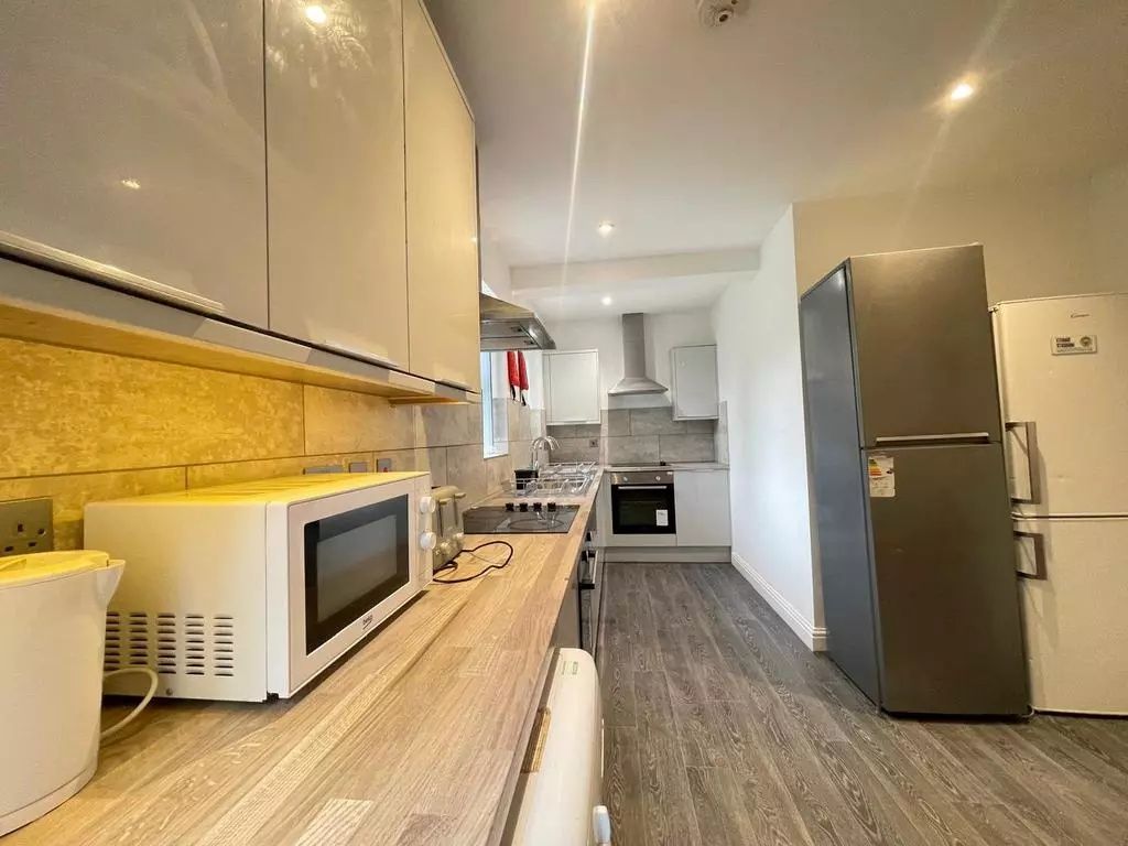 Property photo 3 of 4 Modern Kitchen With Ample Cabinetry, Integrated Ov...