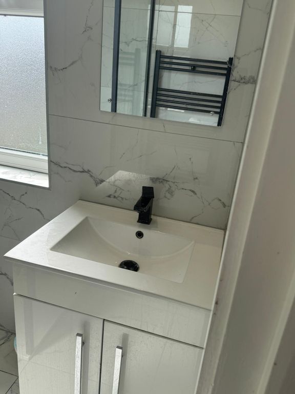 Property photo 3 of 6 Sleek Marble Tiling And Modern Vanity Unit...