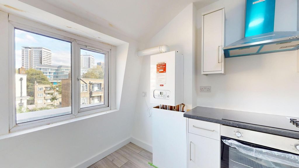 Property photo 2 of 8 Bright And Well-Maintained Kitchen With A Large Wi...