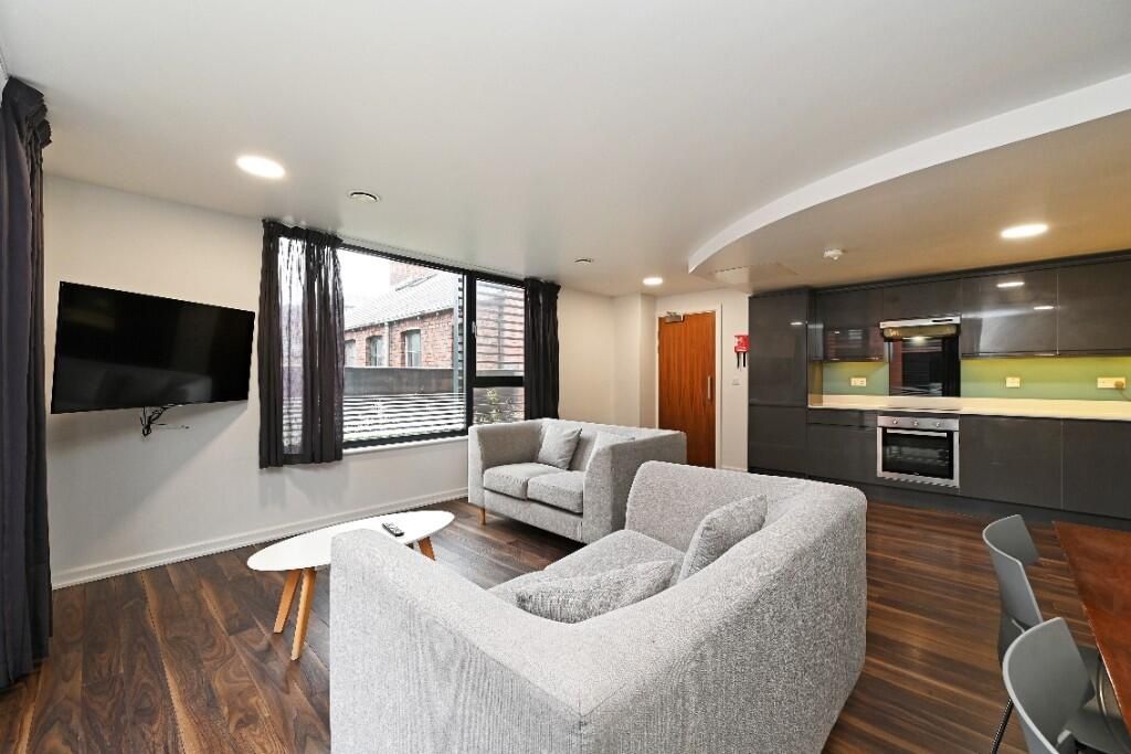Property photo 3 of 12 Bright And Modern Living Room Featuring Comfortabl...