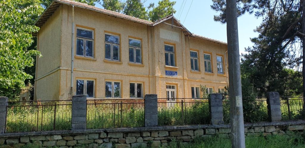 Property photo 2 of 94 Front Facade Of The Former School Building Showing Symmetrical Windows And Entrance Door Behind A Stone And Metal Fence