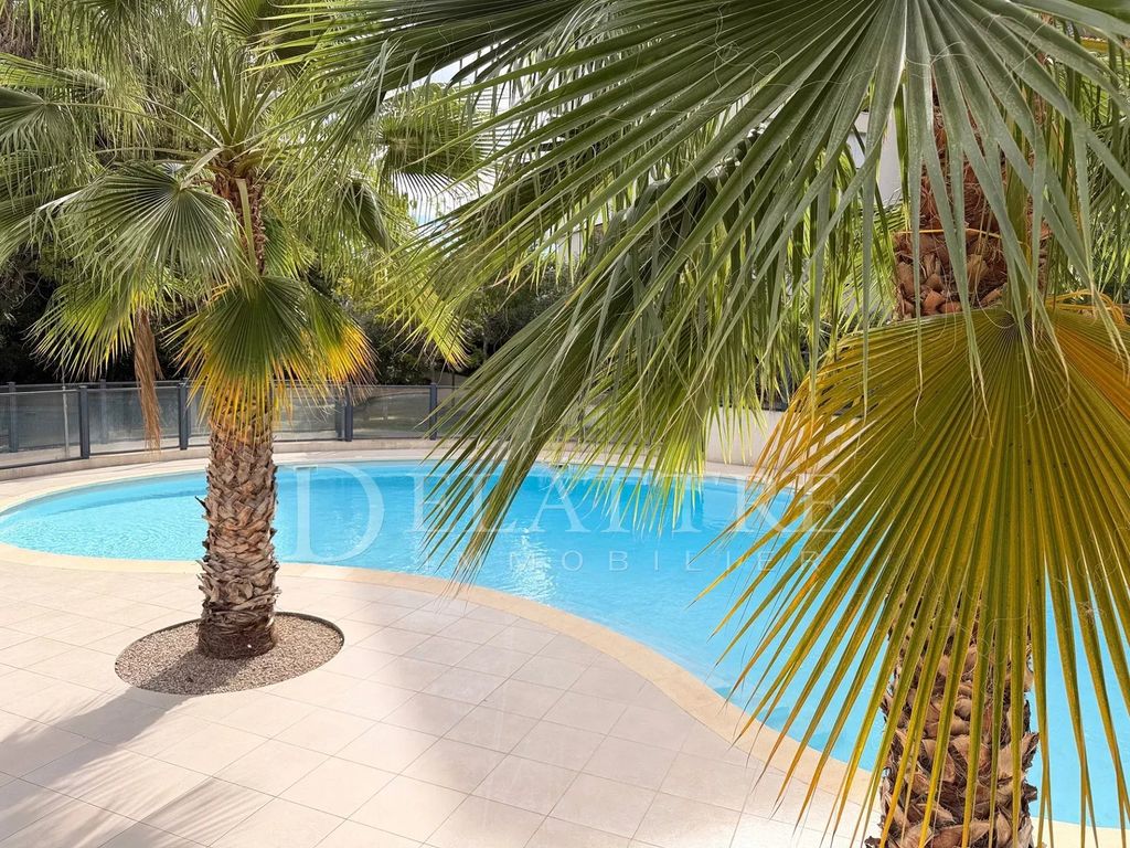 Property photo 1 of 9 1-Bedroom Garden-Level Apartment With Pool, Garage, And View Of Greenery