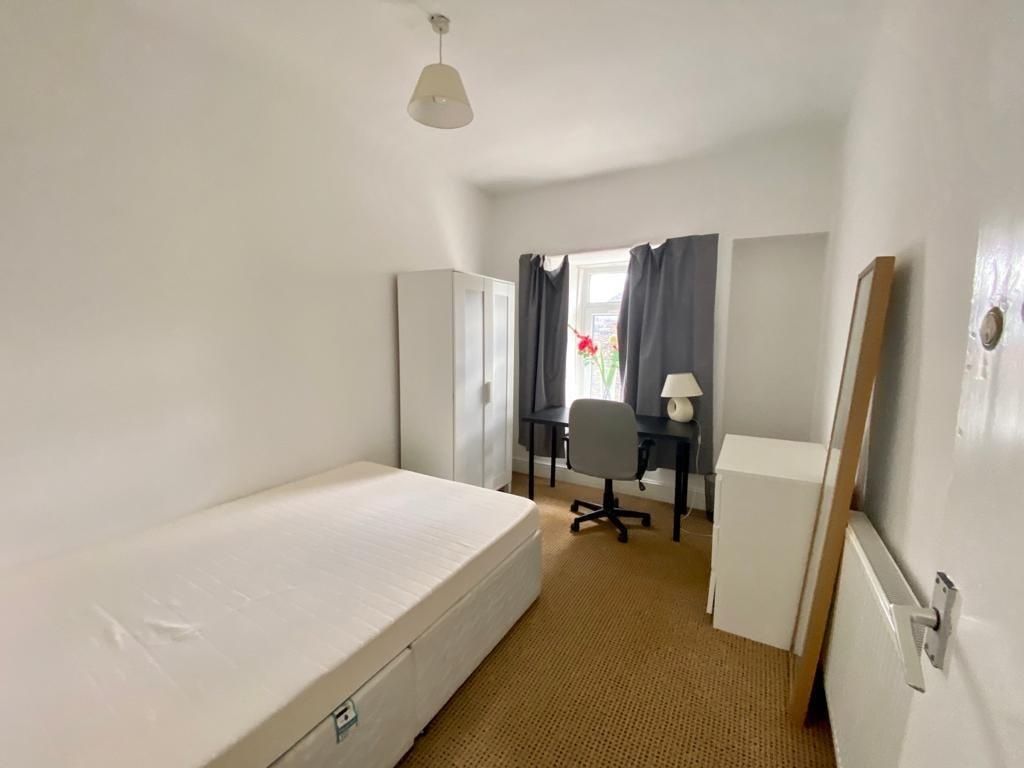 Property photo 3 of 4 Bright Bedroom With Desk And Ample Storage Space...