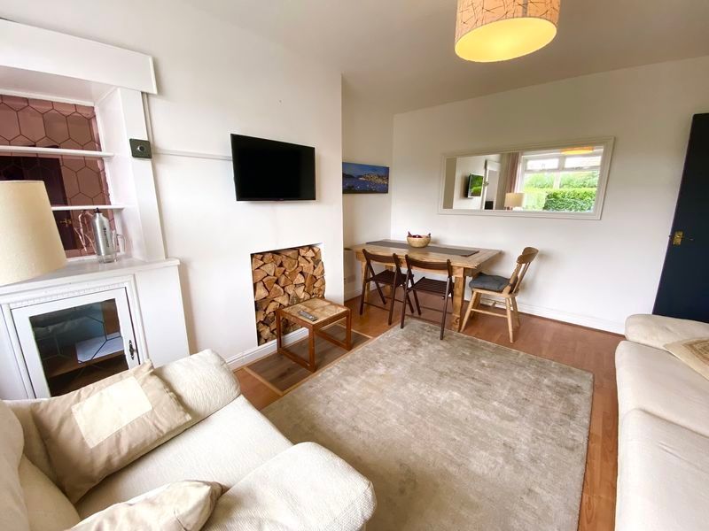 Property photo 2 of 4 This Inviting Living Room Features A Cozy Seating ...