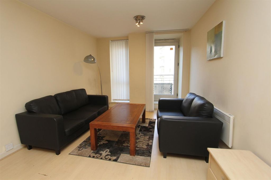 Property photo 2 of 9 Bright Lounge With Sleek Leather Sofas...