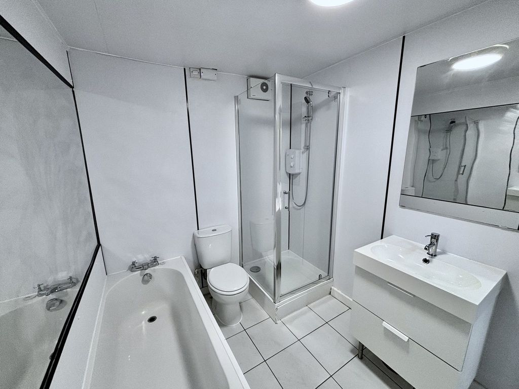 Property photo 3 of 13 A Spacious And Modern Bathroom Featuring Both A Ba...