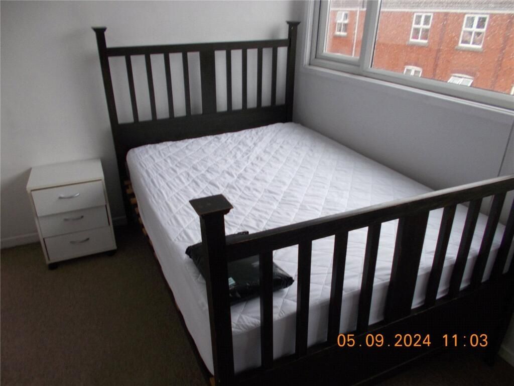 Property photo 1 of 8 A Bright Double Bedroom Featuring A Sleek Black Wo...