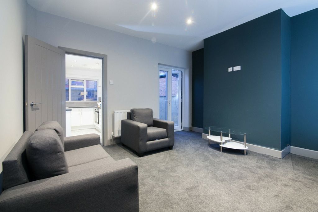 Property photo 3 of 5 This Contemporary Living Room Features A Modern De...