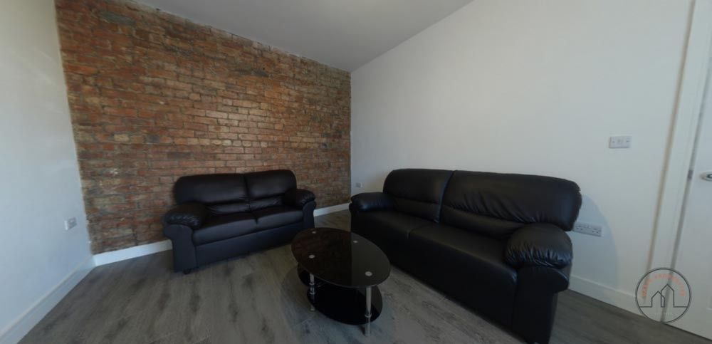 Property photo 2 of 15 A Spacious And Modern Living Room Featuring Comfor...