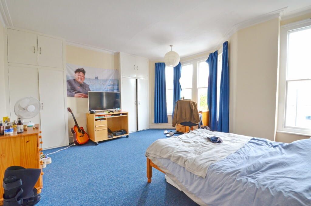 Property photo 2 of 10 Spacious And Bright Master Bedroom Featuring A Dou...