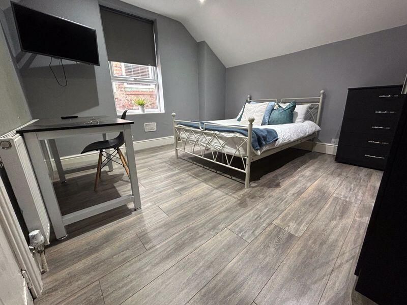 Property photo 3 of 10 A Modern Double Bedroom Featuring A Stylish Metal ...