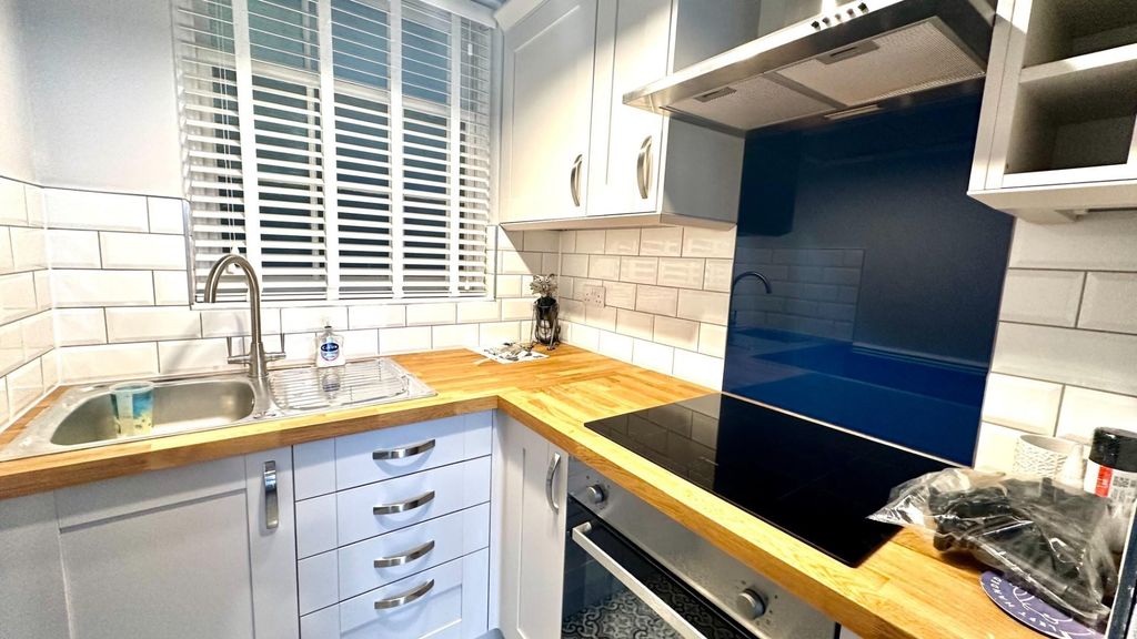 Property photo 3 of 5 Bright Kitchen With Modern Blue Splashback...