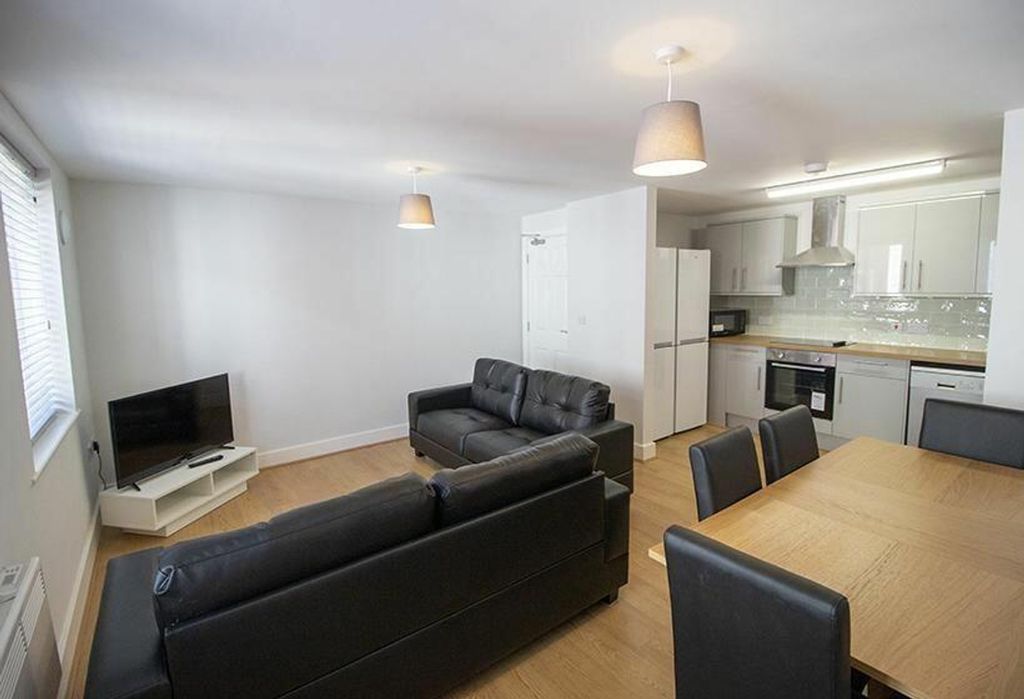 Property photo 2 of 7 A Modern And Inviting Living Room Featuring Comfor...