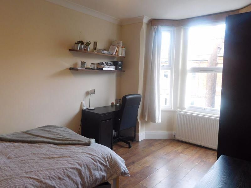 Property photo 1 of 10 A Bright And Inviting Living Room With Large Windo...