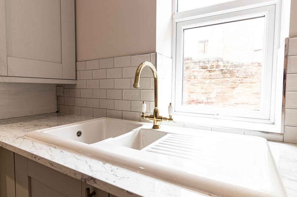 Property photo 3 of 14 Bright And Modern Bathroom Featuring A White Tiled...