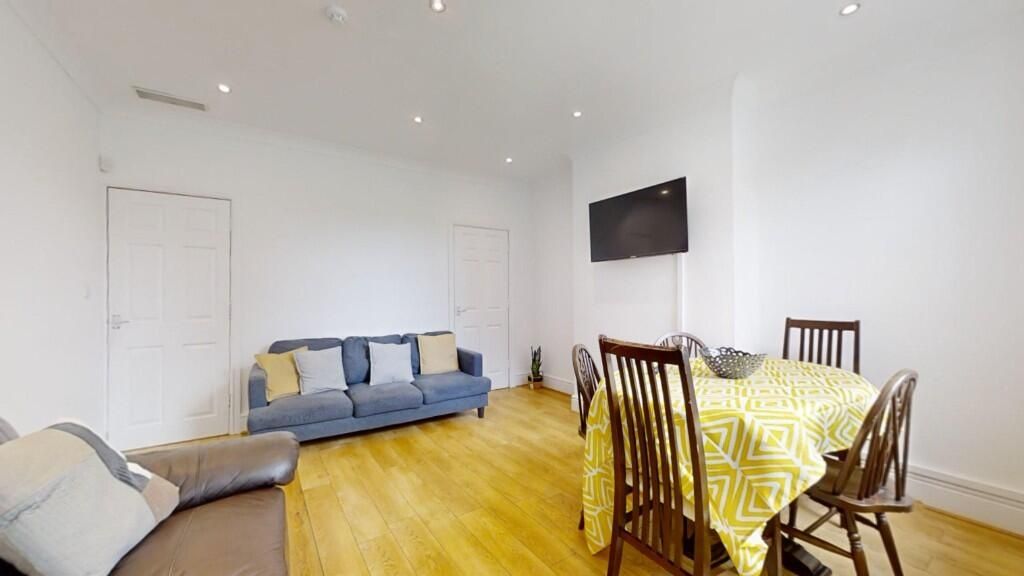 Property photo 3 of 13 Bright And Welcoming Living Room Featuring Comfort...