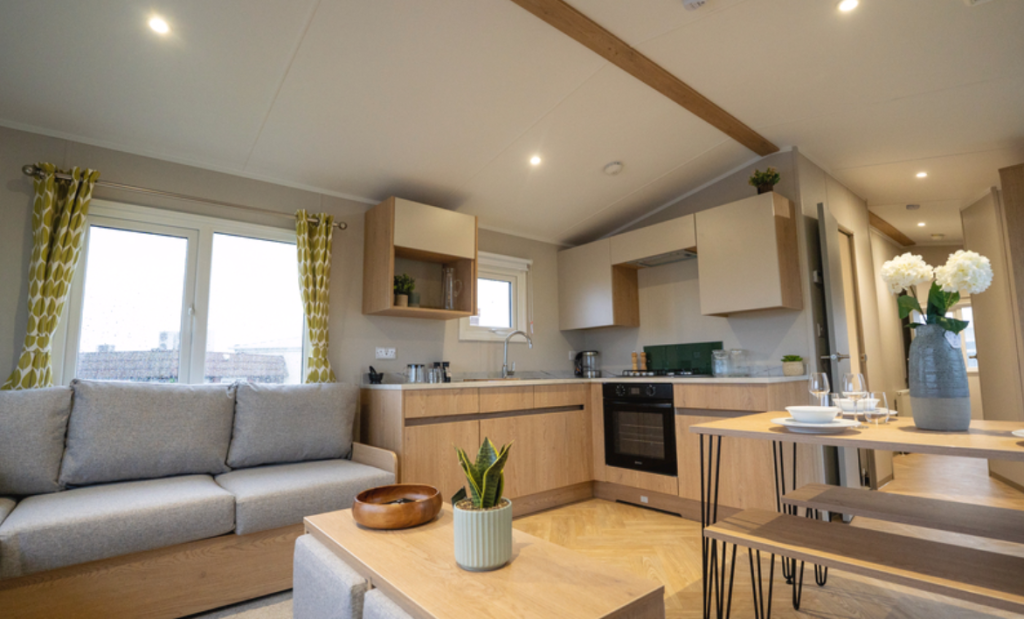 Property photo 2 of 15 Modern Kitchen And Lounge With Grey Sofa And Wood Effect Finishes In The Victory Willow