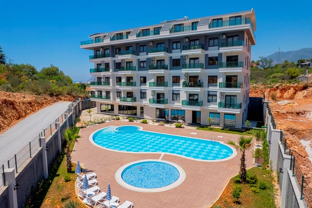 Property photo 1 of 26 A Deluxe Duplex Apartment For Sale In Alanya Â€“ Main View Of The Complex And Apartment Block