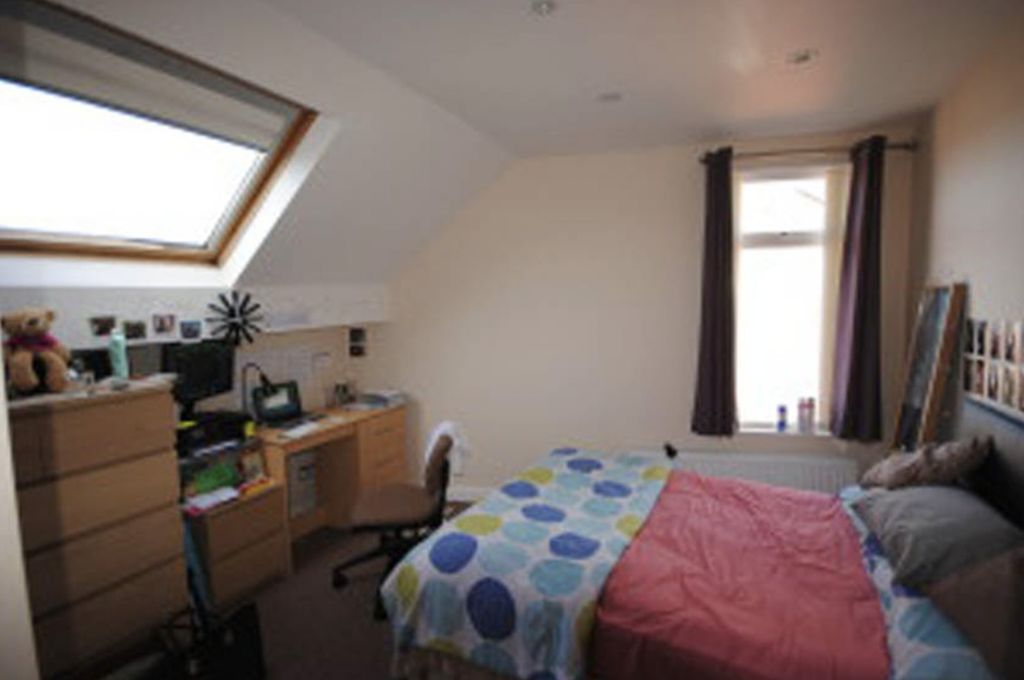 Property photo 3 of 9 A Bright And Inviting Bedroom Featuring A Neatly m...