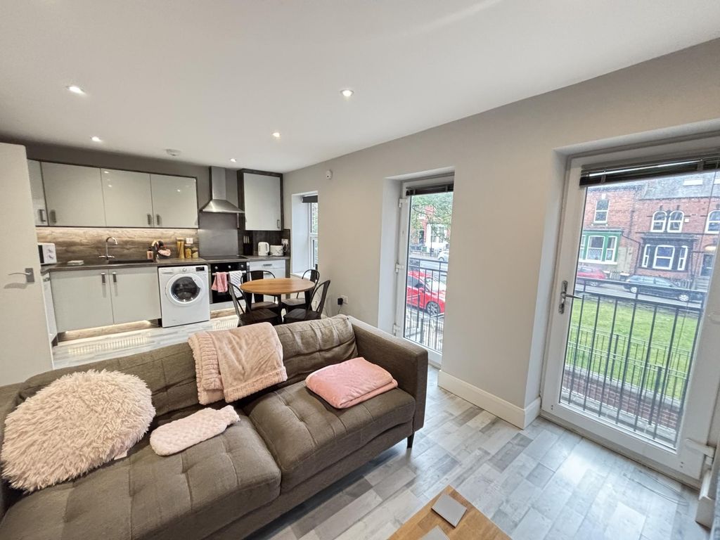 Property photo 3 of 17 A Bright And Modern Living Room With Ample Natural...