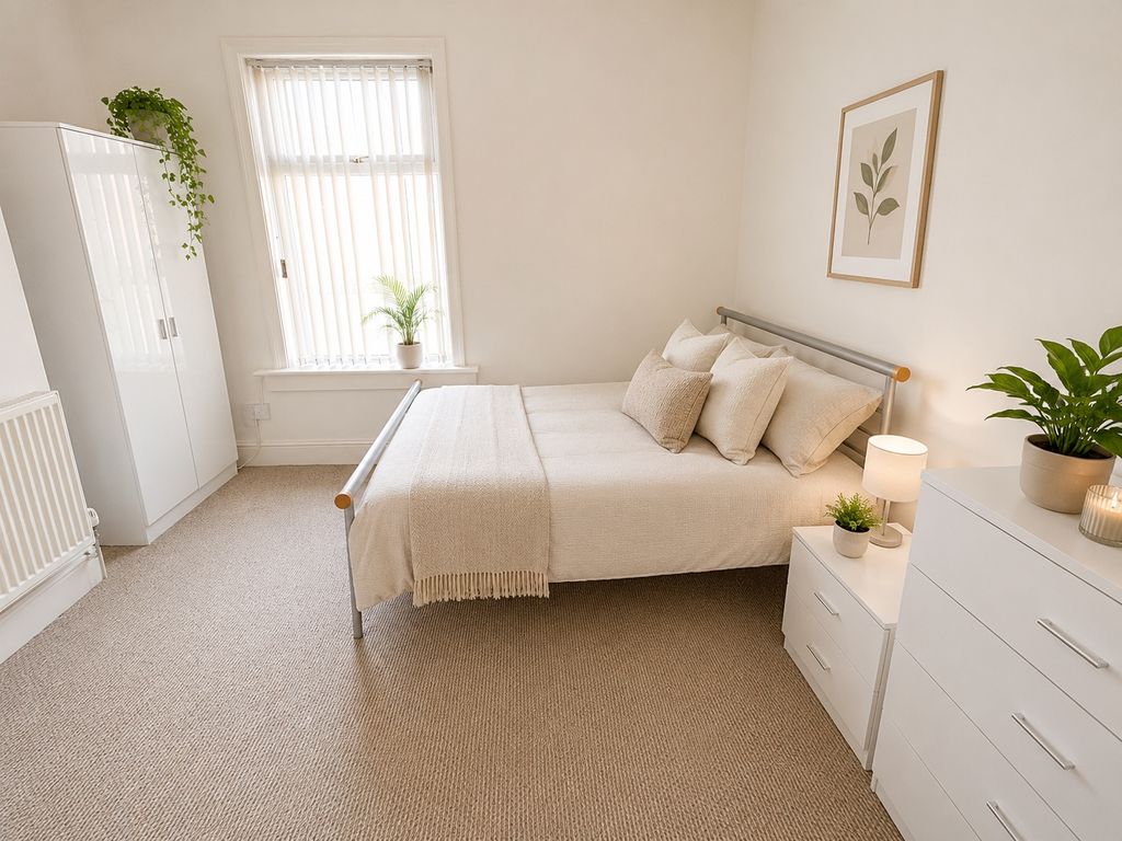 Property photo 2 of 8 Bright And Airy Bedroom With Stylish Decor And Sto...
