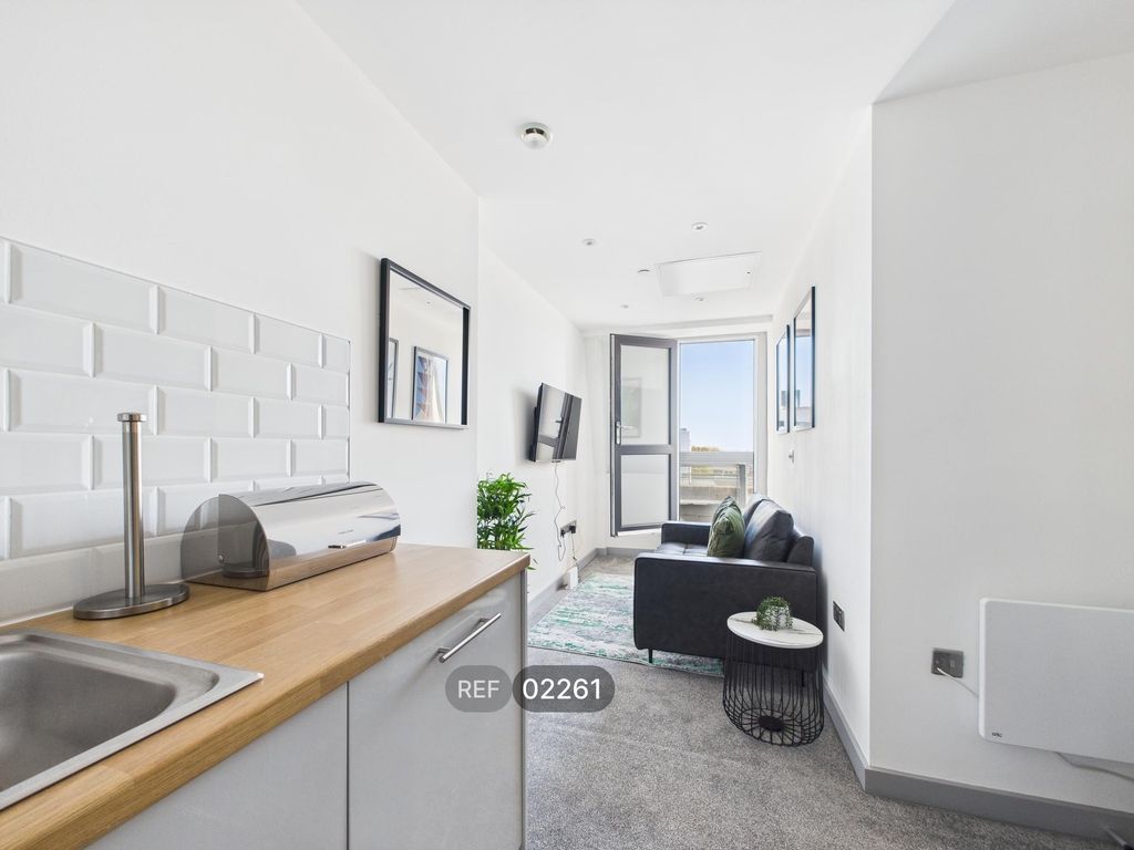Property photo 3 of 12 Kitchen & Living Area