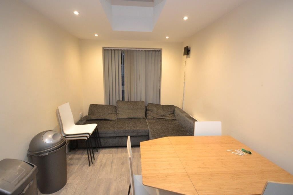 Property photo 2 of 12 A Tidy, Well-Lit Living Room With A Sofa And Dinin...