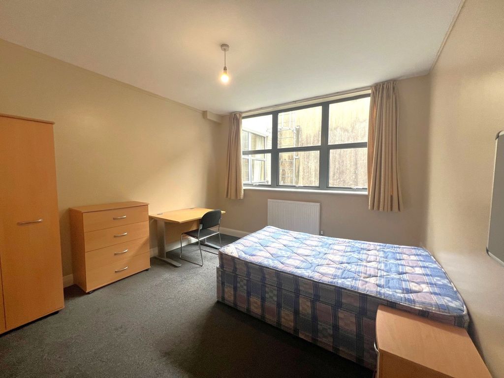 Property photo 2 of 12 Bright, Simply Furnished Bedroom With A Large Wind...