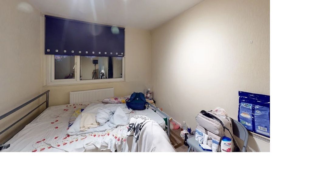 Property photo 3 of 4 A Modest Single Bedroom With A Bed, A Small Desk, ...