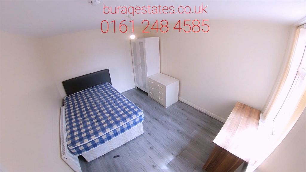 Property photo 1 of 11 A Cozy Single Bedroom Featuring A Bed With A Check...