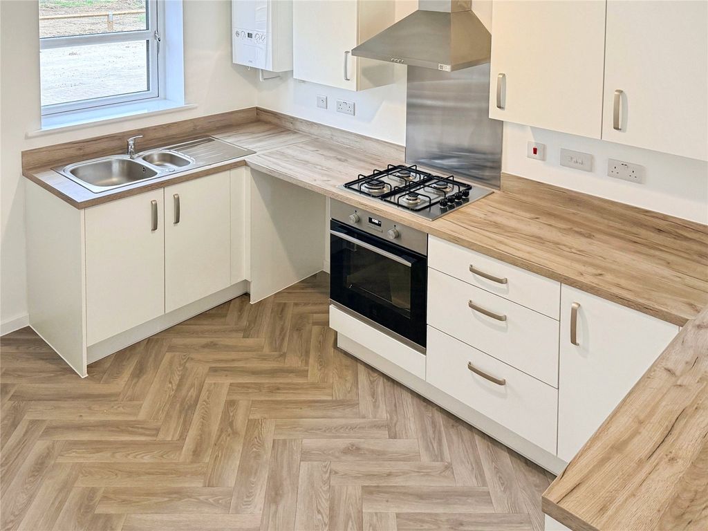 Property photo 2 of 12 Kitchen Area