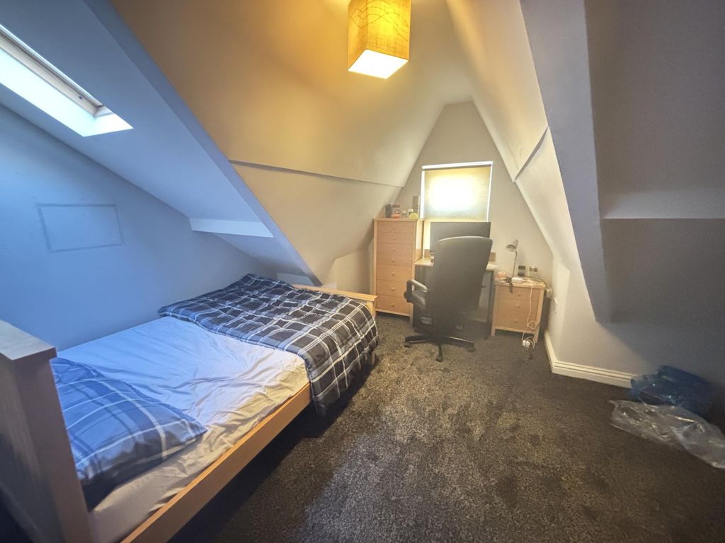 Property photo 1 of 9 A Cozy Single Bedroom With A Neatly Made Bed, A Wi...