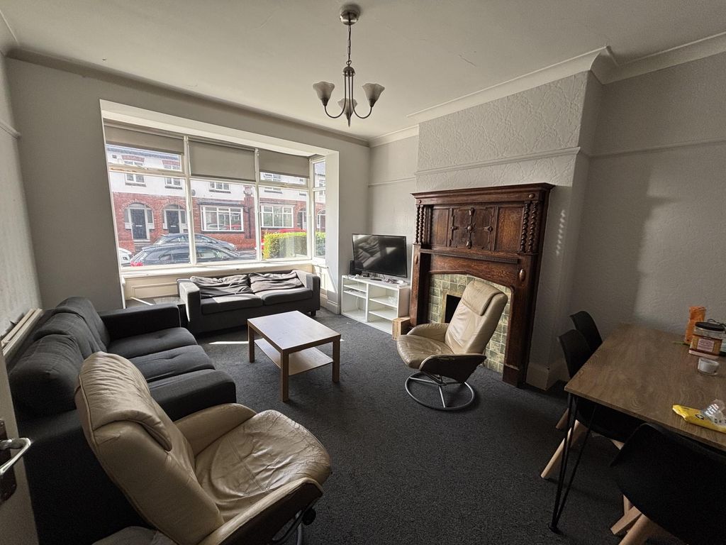 Property photo 1 of 22 A Well-Lit, Inviting Living Room Featuring A mix O...