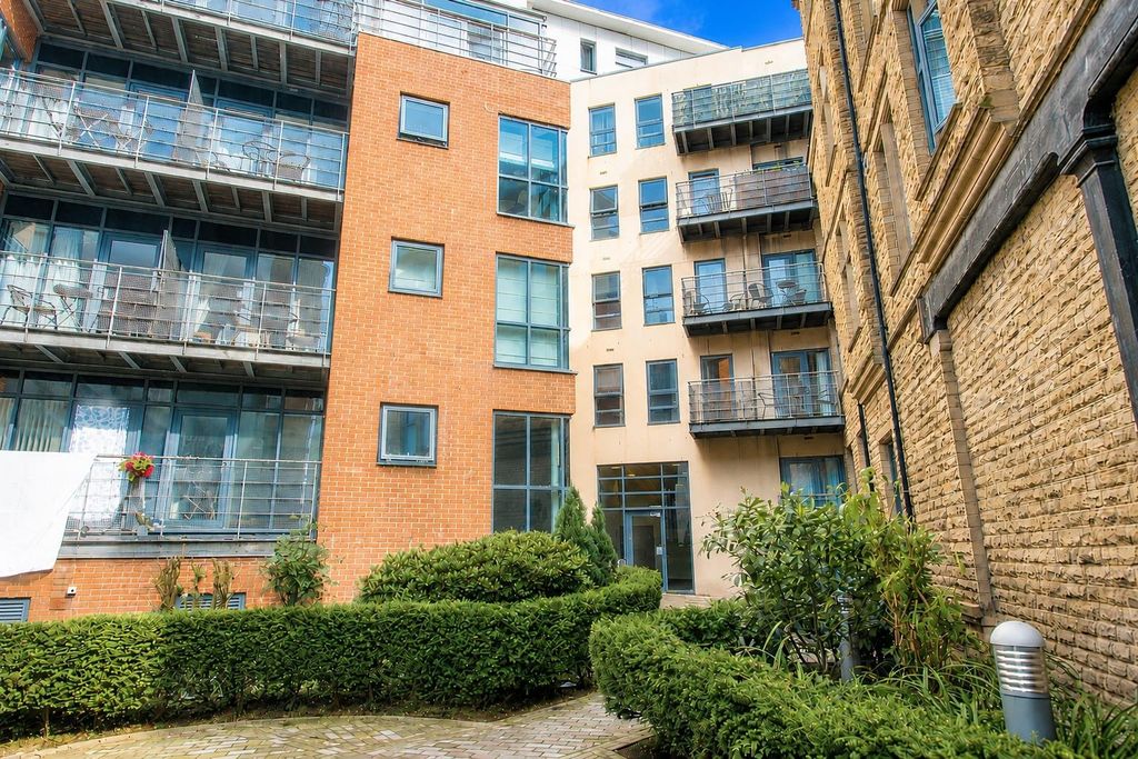 Property photo 1 of 10 Modern Apartment Complex With Green Landscaping...