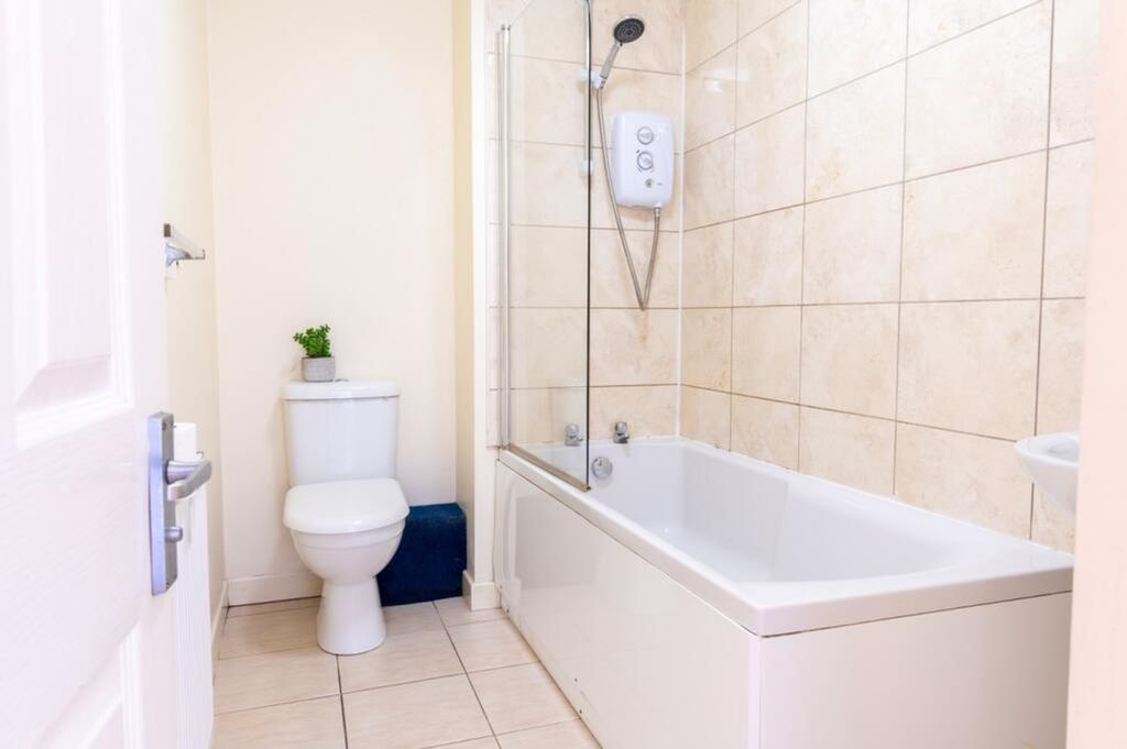 Property photo 2 of 11 This Well-Maintained Bathroom Features A Modern Ba...
