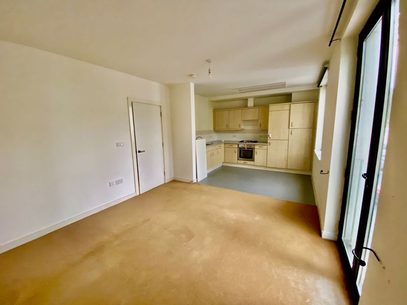 Property photo 2 of 11 Living Room To Kitchen