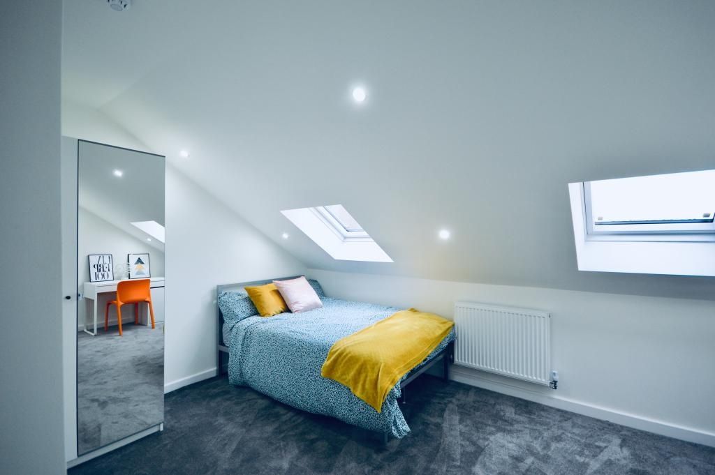 Property photo 3 of 13 A Bright, Modern Bedroom Featuring A Double Bed Wi...