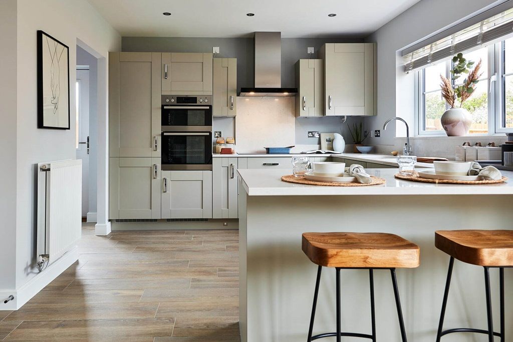 Property photo 3 of 13 The Kitchen Features A Breakfast Bar, Creating A Sociable Space For The Family