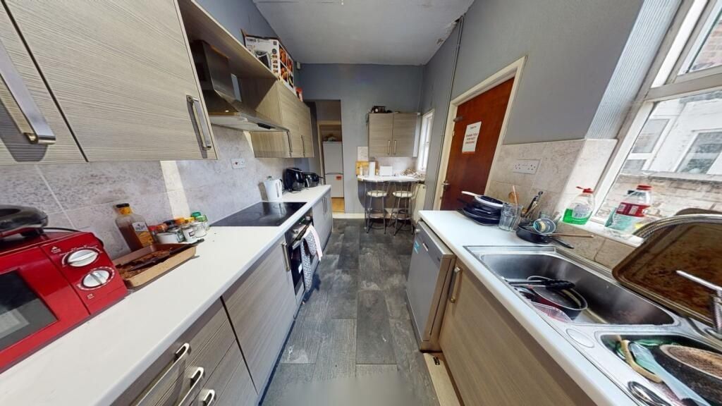 Property photo 3 of 7 Bright And Modern Kitchen Space Featuring Ample Co...
