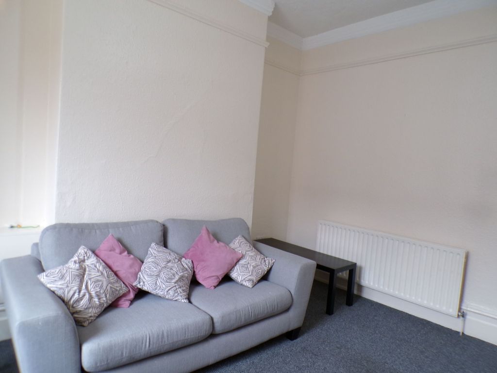 Property photo 1 of 11 A Spacious Living Room Featuring A Comfortable Lig...