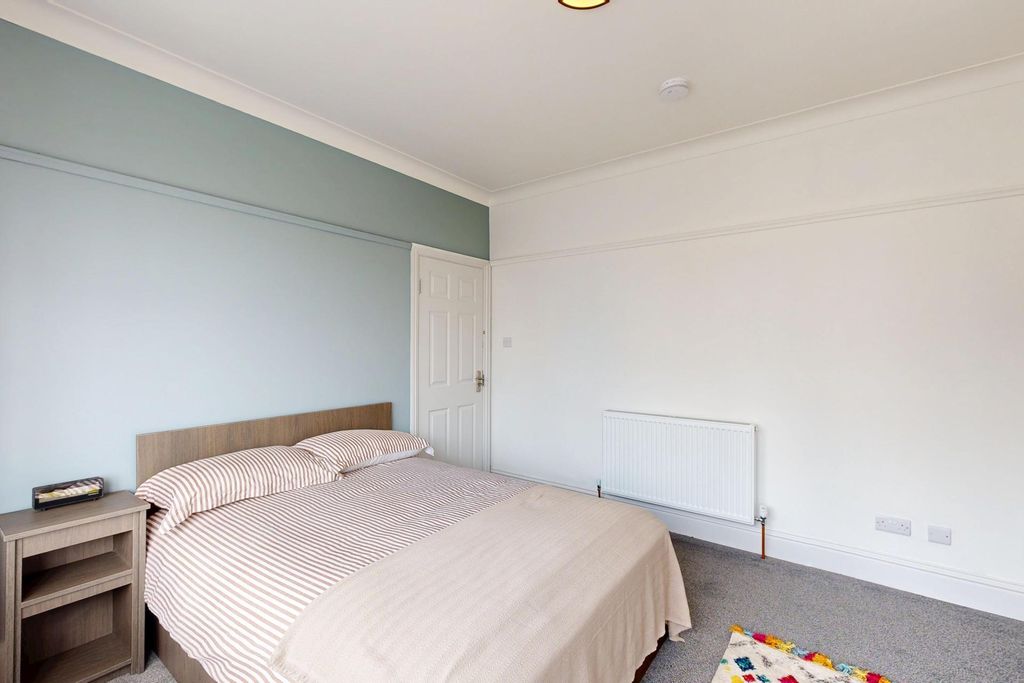 Property photo 2 of 10 A Bright And Welcoming Bedroom Featuring A Double ...