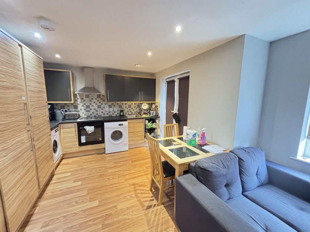 Property photo 2 of 7 Bright And Welcoming Living Room Featuring Modern ...