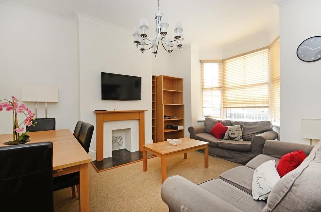 Property photo 2 of 9 A Cozy Living Room Featuring Neutral Tones, A Fire...