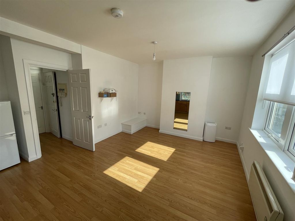 Property photo 2 of 12 Bright Living Room With Sleek Wood-Style Flooring...