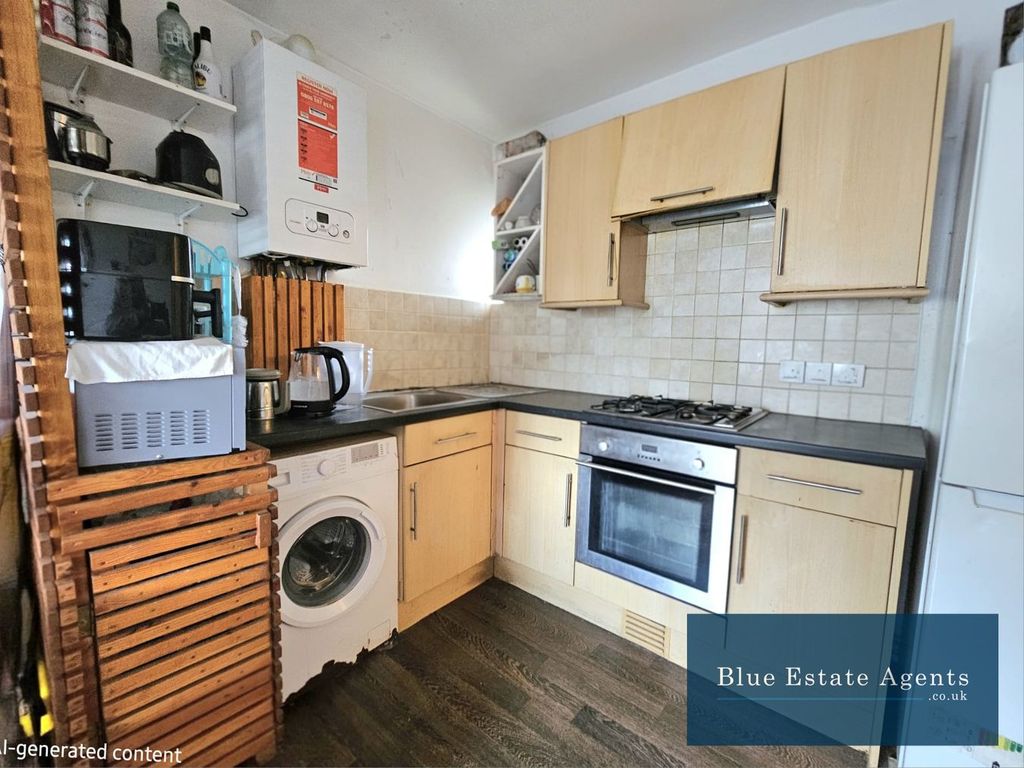 Property photo 3 of 7 Kitchen Area