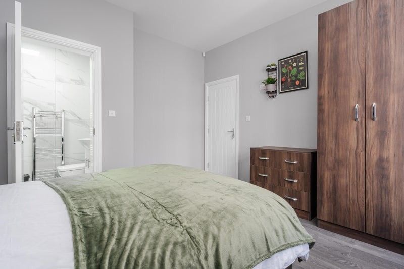 Property photo 2 of 9 This Inviting Double Bedroom Features A Plush Gree...