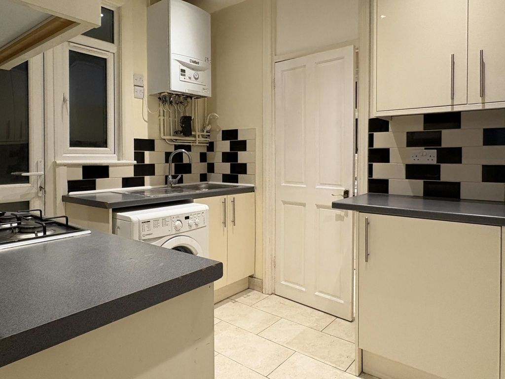 Property photo 3 of 15 Neat Modern Kitchen With Light Cream Cabinets, Con...