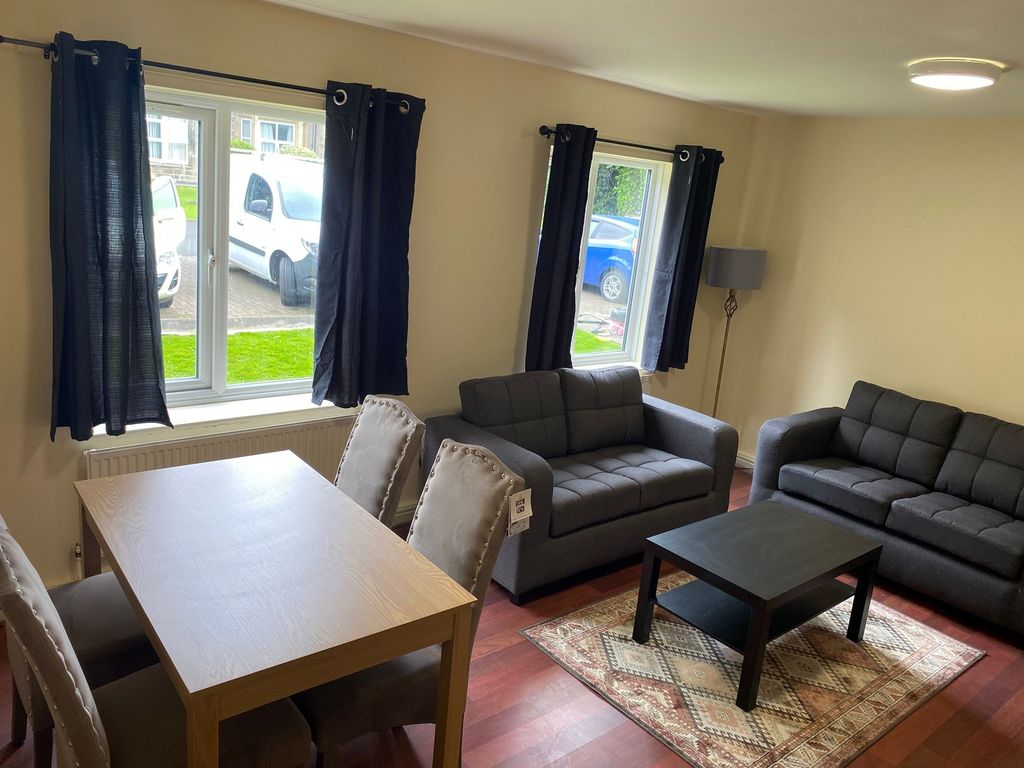 Property photo 1 of 6 A Bright And Inviting Living Room Featuring Two Co...