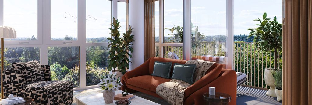 Property photo 2 of 5 Living Space With Sofa And Coffee Table Adjacent To Balcony Doors, Wrap-Around Windows For Ample