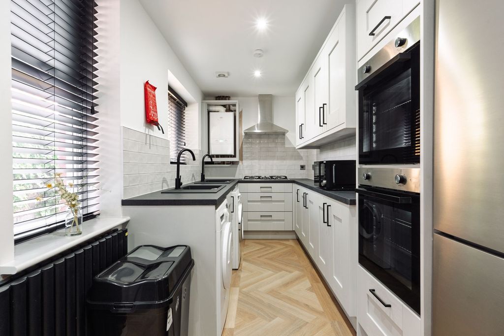 Property photo 2 of 4 Contemporary Galley Kitchen With White Cabinetry, ...